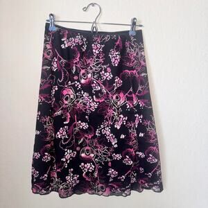 Whimsical pink and black floral wrapper midi skirt